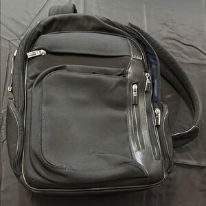 Tumi arrive kingsford black backpack canvas